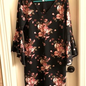 Women’s floral, bell sleeved dress. Ideal for office use, dinner, or party.